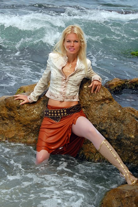 #94 - Wetlook by Tanned Blonde in Jacket, White Stockings, Skirt and Shoes on Sea