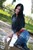 wet girl get wet wet hair fully clothed jacket jeans denim leather jackboots heels lake