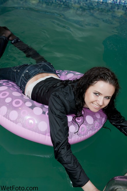 brunette wet girl get wet fully clothed t-shirt jacket jeans high-heeled shoes wet hair pool
