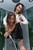 wet girl get wet wet hair fully clothed jeans blouse high heels shower