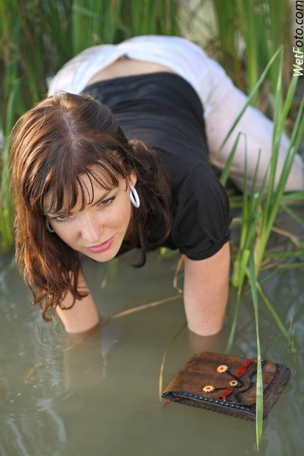 wet girl get wet wet hair swim fully clothed soaking wet pants blouse hat high heels lake