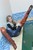 wet girl get wet wet hair swim fully clothed vest sweater tight jeans jackboots pool