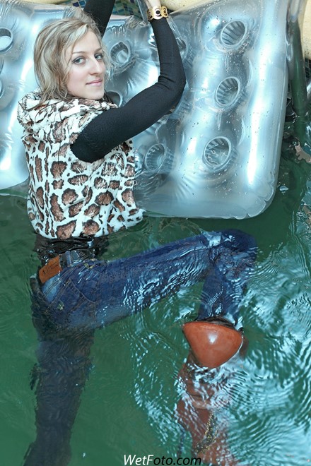 wet girl get wet wet hair swim fully clothed vest sweater tight jeans jackboots pool