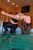 wet girl wet hair get wet swim fully clothed top patent leather leggings high heels sandals fully soaked pool