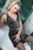 wet girl get wet wet hair fully clothed corset skirt stockings high heels shower bath