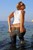 wet girl wet hair get wet swim fully clothed t-shirt jacket tight jeans high heels sandals fully soaked sea