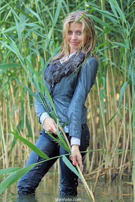 wet girl get wet wet hair swim fully clothed leather jacket fur jeans shirt high heels shoes lake