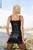 wet girl get wet fully clothed t-shirt mini skirt stockings leather jackboots sea