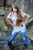 wet girl get wet wet hair jeans blouse high heels sandals sea