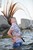 wet girl get wet wet hair jeans blouse high heels sandals sea