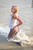blonde wet girl wet hair get wet fully clothed t-shirt jacket leggings high heels lake