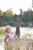 blonde wet girl wet hair get wet fully clothed t-shirt jacket leggings high heels lake