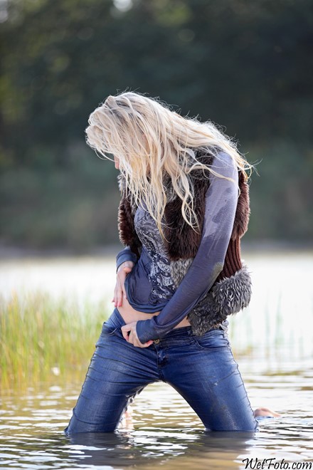 wet girl get wet wet hair vest tight jeans blouse high heels lake