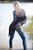wet girl get wet wet hair vest tight jeans blouse high heels lake