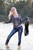 wet girl get wet wet hair vest tight jeans blouse high heels lake