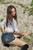 wet girl get wet wet hair fully clothed golf shorts denim leather jackboots lake