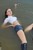 wet girl get wet wet hair fully clothed golf shorts denim leather jackboots lake