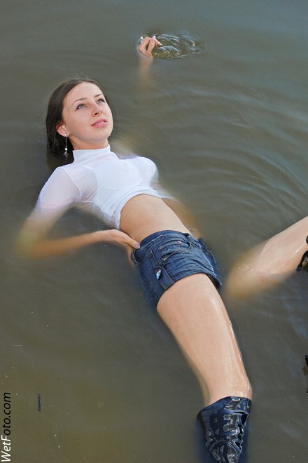 wet girl get wet wet hair fully clothed golf shorts denim leather jackboots lake