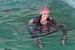 wet girl get wet wet hair swim fully clothed tight jeans jacket scarf gloves hat sneakers pool