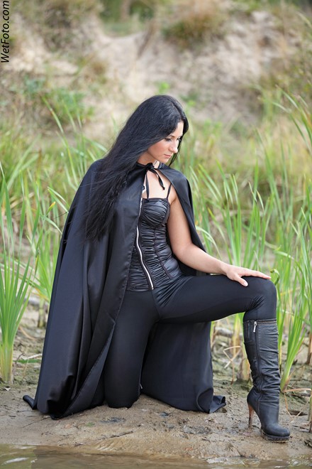brunette wet girl wet hair get wet fully clothed corset leggings leather mantle high heels boots lake