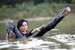 brunette wet girl wet hair get wet fully clothed corset leggings leather mantle high heels boots lake