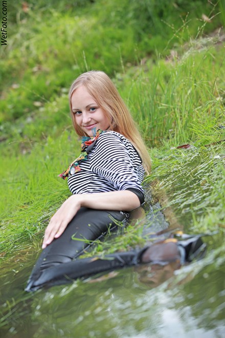 wet girl get wet wet hair fully clothed leggings tights blouse high heels lake