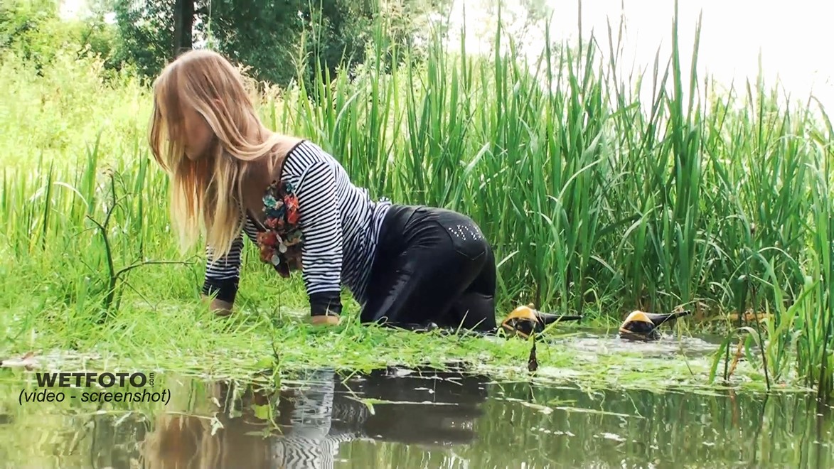 wet girl get wet wet hair fully clothed leggings tights blouse high heels lake
