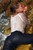 wet girl get wet wet hair fully clothed jeans blouse high heels sea