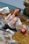 wet girl get wet wet hair fully clothed jeans blouse high heels sea