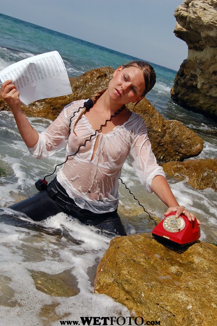 wet girl get wet wet hair fully clothed jeans blouse high heels sea