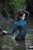 wet girl get wet wet hair blouse jeans stockings high heels sandals mud laky