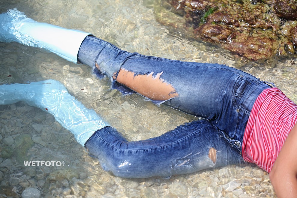 wet girl get wet tight jeans sweater shirt boots swim fully clothed wet hair