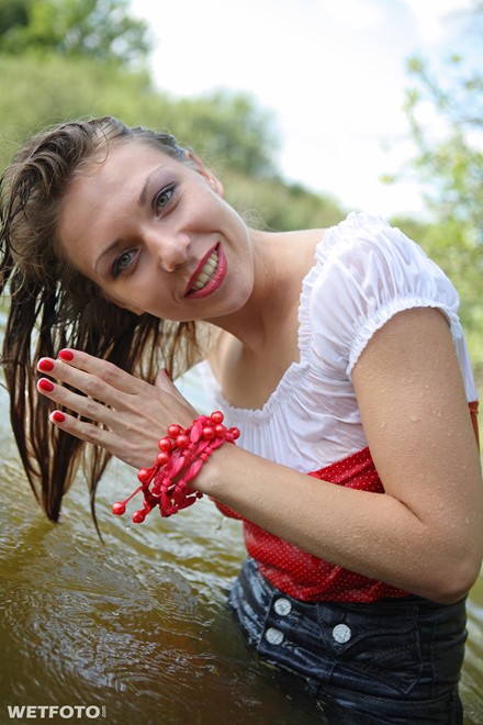 wet girl get wet tights denim shorts blouse high heels lake