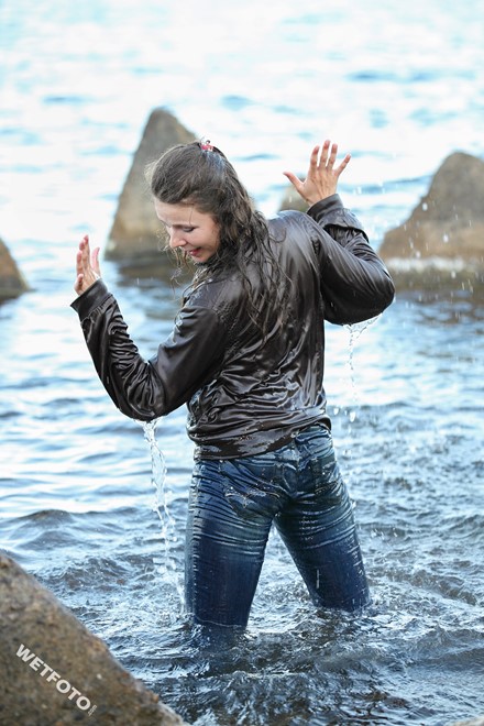 wet girl get wet swim fully clothed wet hair jacket shirt jeans sea