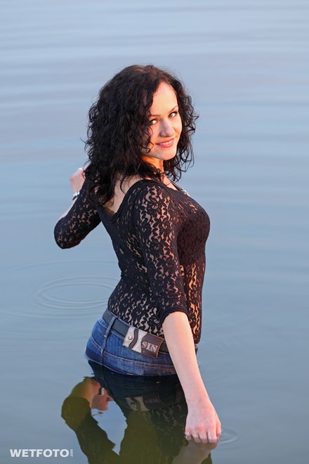 wet girl get wet fully clothed jeans blouse shoes high heels lake