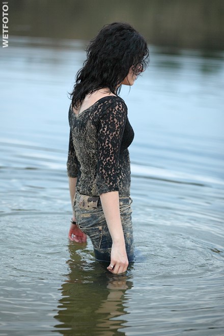 wet girl get wet fully clothed jeans blouse shoes high heels lake