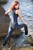 wet girl get wet wet hair fully clothed denim jumpsuit sneakers sea