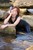wet girl get wet wet hair fully clothed denim jumpsuit sneakers sea