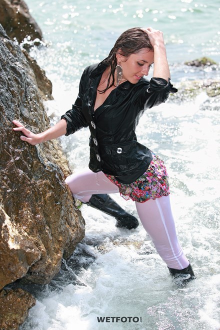 wet girl get wet fully clothed jacket leggings skirt leather boots heels sea