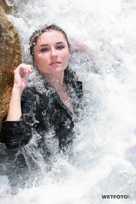 wet girl get wet fully clothed jacket leggings skirt leather boots heels sea