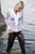 wet woman get wet fully clothed blouse leggings shoes sea