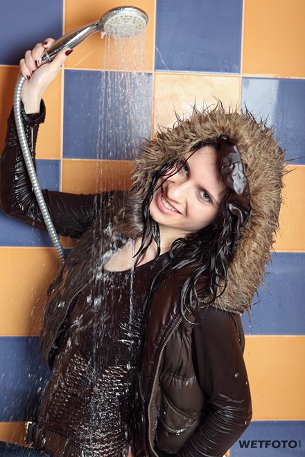 wet woman get wet wet hair fully clothed jacket sweater jeans boots bath