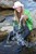 wet girl get wet jacket jeans blouse hat shoes sea
