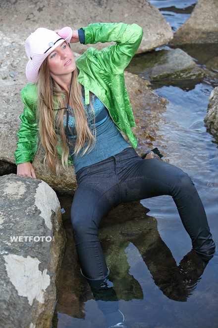 wet girl get wet jacket jeans blouse hat shoes sea