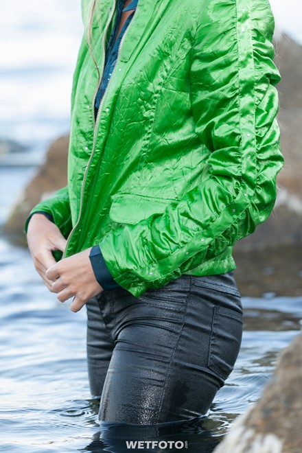 wet girl get wet jacket jeans blouse hat shoes sea