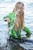 wet girl get wet jacket jeans blouse hat shoes sea