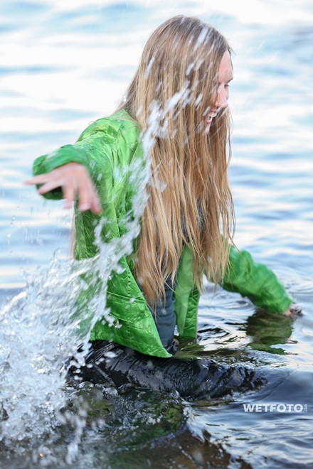 wet girl get wet jacket jeans blouse hat shoes sea