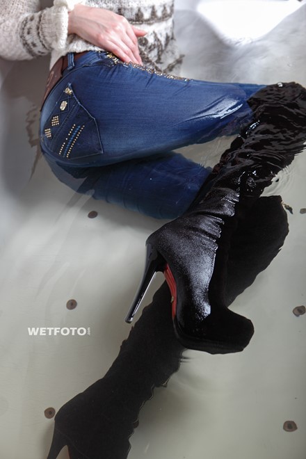wet girl get wet wet hair fully clothed jacket sweater jeans high heels boots jacuzzi