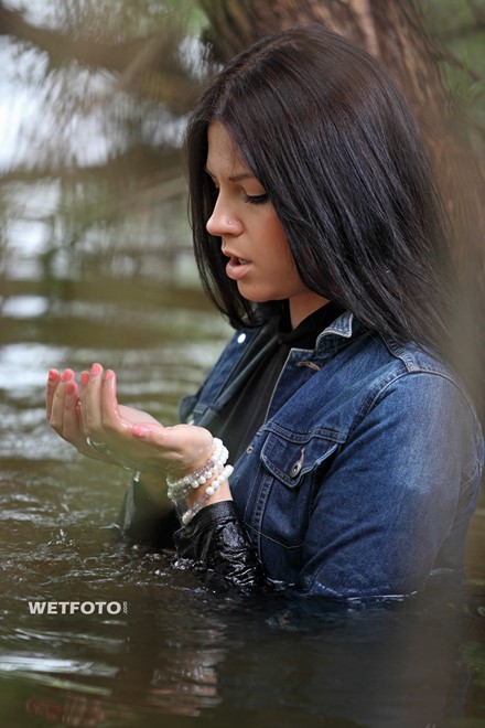 wet girl brunette get wet fully clothed skinny jeans jacket denim tights leather boots heels lake