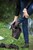 wet girl brunette get wet fully clothed skinny jeans jacket denim tights leather boots heels lake